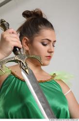 Woman Adult Average White Fighting with sword Standing poses Casual